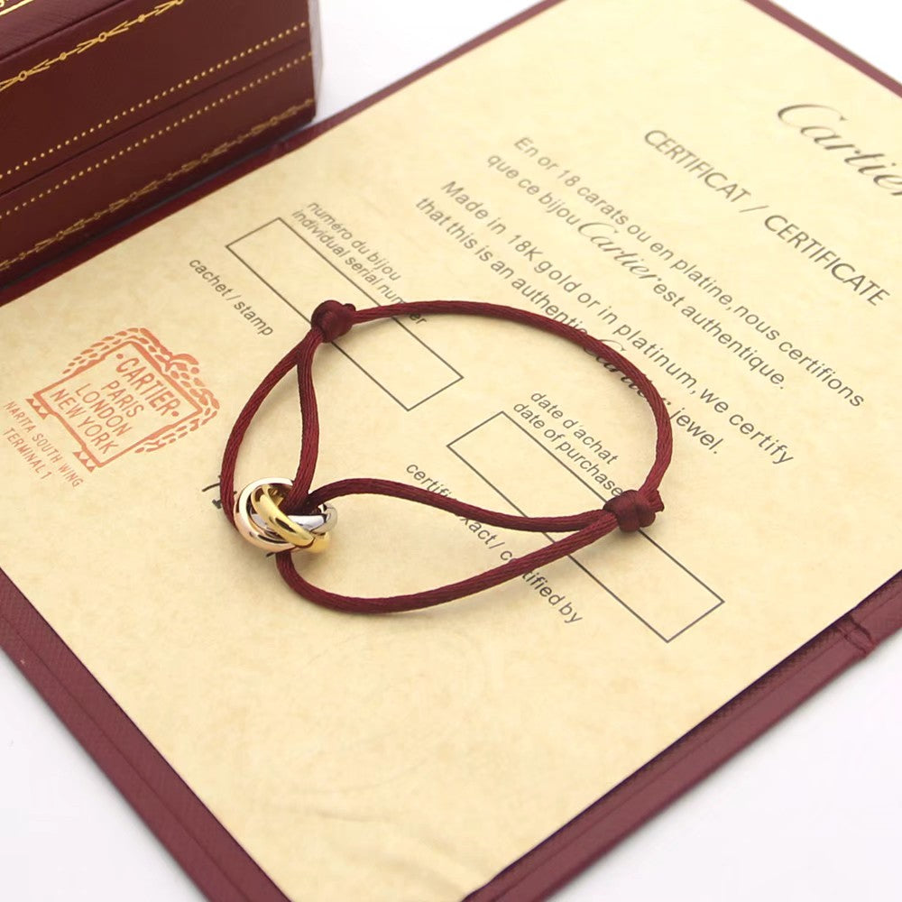 CARTIER TRINITY PINK GOLD SILVER GOLD TEXTILE BRACELET