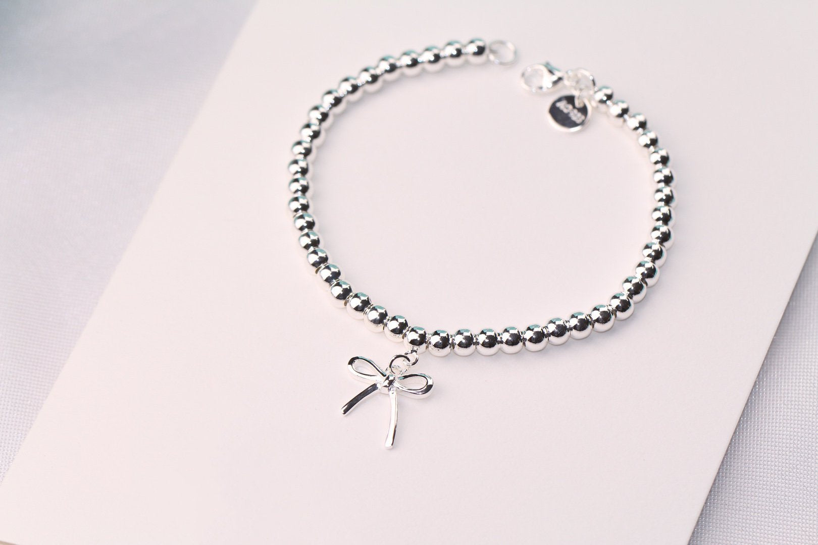 TIFFANY STERLING SILVER BOW BEAD BRACELET